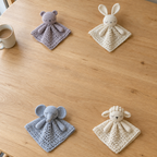 Sleepy Animal Lovey crochet collection in its existing home scene.