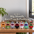 Seven crochet character key pouches on a sunlit wooden entryway console beneath the title 21-in-1, Big Mouth, Key Pouch Pattern.