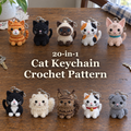 Ten small crocheted cat keychains in two rows on a wooden home table, with the title 20-in-1 Cat Keychain Crochet Pattern across the open centre.