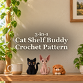 Black Cat, blush Sphynx and ginger Scottish Fold crochet shelf buddies sit together on a sunlit wooden shelf beside a mug and houseplants, below the title 3-in-1 Cat Shelf Buddy Crochet Pattern.