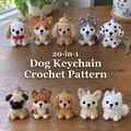 Ten small crocheted dog keychains with silver rings and clasps arranged in two rows on a wooden table, with the title 20-in-1 Dog Keychain Crochet Pattern.