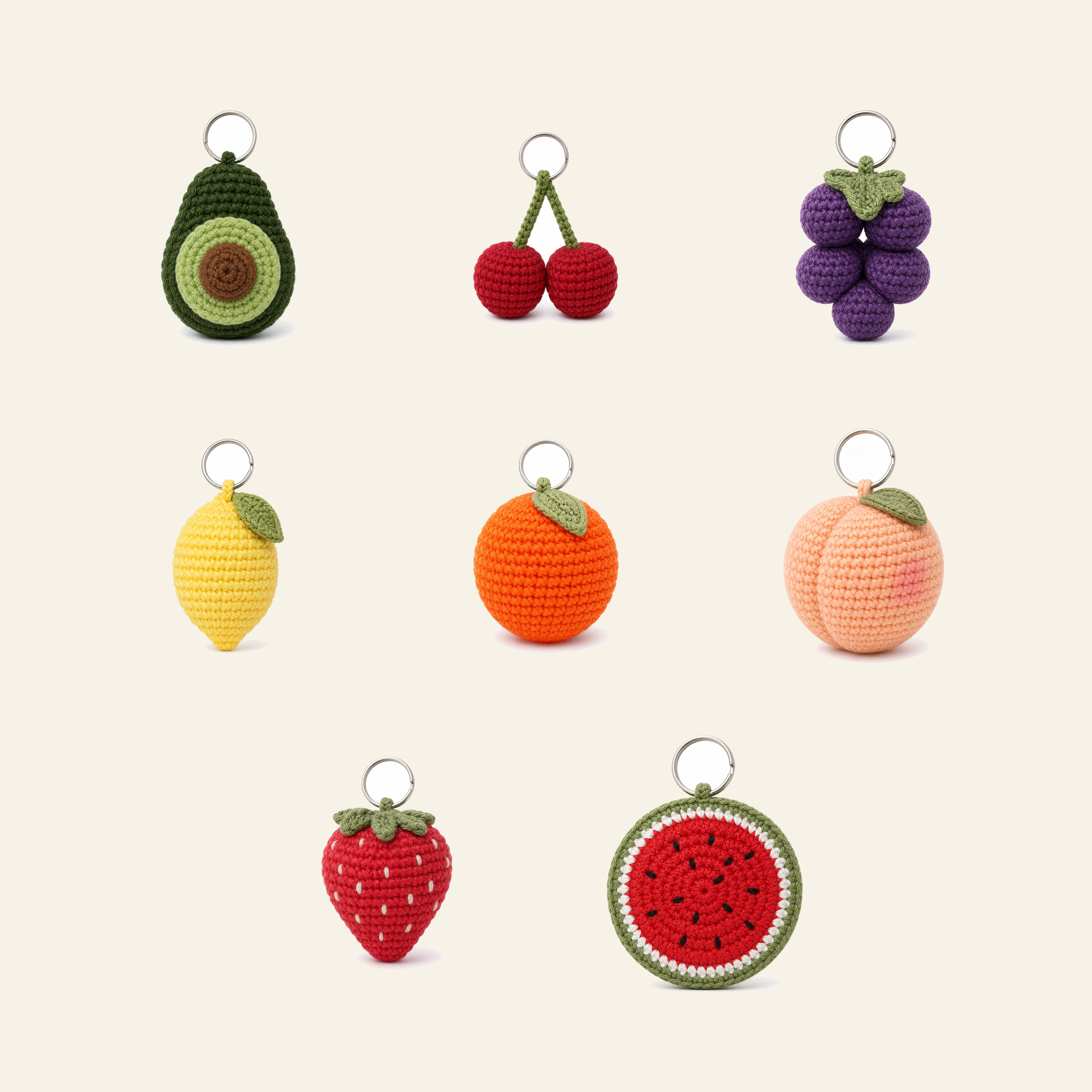 All 8 fruit crochet bag charms in the set, shown together