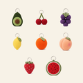 All 8 fruit crochet bag charms in the set, shown together