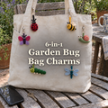 Six crochet garden bug bag charms beside keys: ladybug, bee, butterfly, snail, caterpillar and dragonfly.