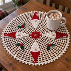 White Christmas gnome crochet doily with a mug of cocoa and marshmallows on the open mesh, showing red hat stitches, round noses and white bobbly beards.