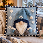 Snow Gnome crochet pillow with an ice-blue hat, navy brim, white snowflakes and white bobbles on a pale blue front, resting on a snowy window seat.