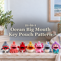 Seven ocean-themed crochet key pouches beneath the title 21-in-1 Ocean Big Mouth Key Pouch Pattern on a coastal console.