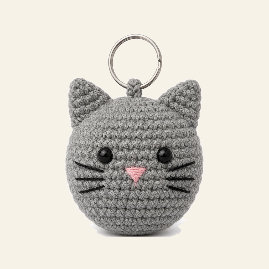 The finished crochet Cat bag charm on its own