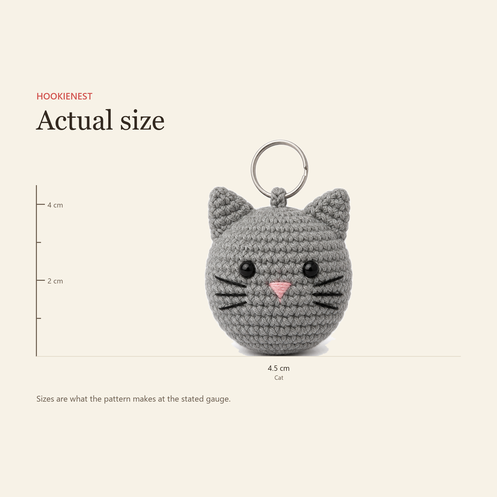 The Cat charm beside a centimetre ruler, finishing at 4.5 cm