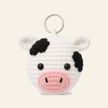 The finished crochet Cow bag charm on its own