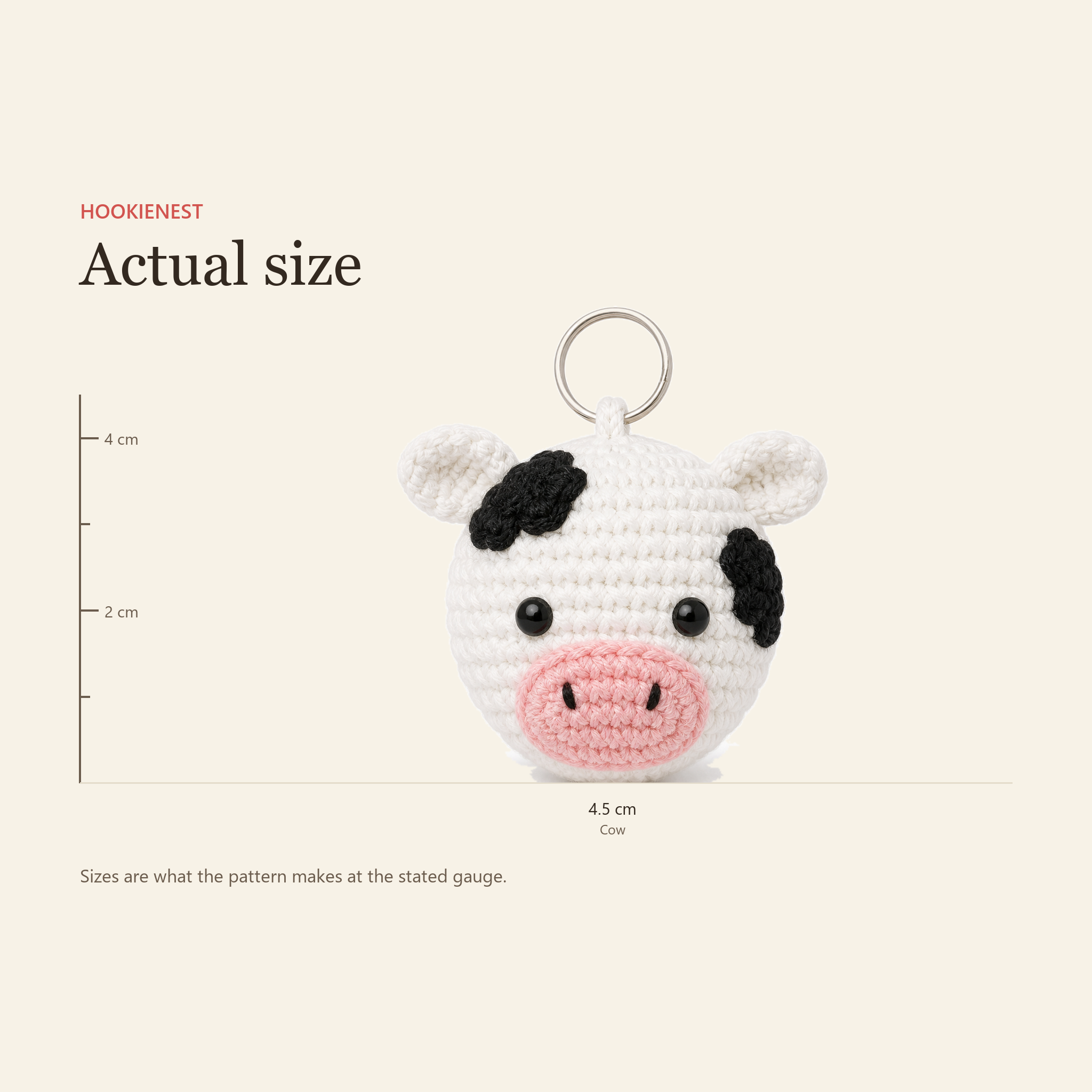 The Cow charm beside a centimetre ruler, finishing at 4.5 cm