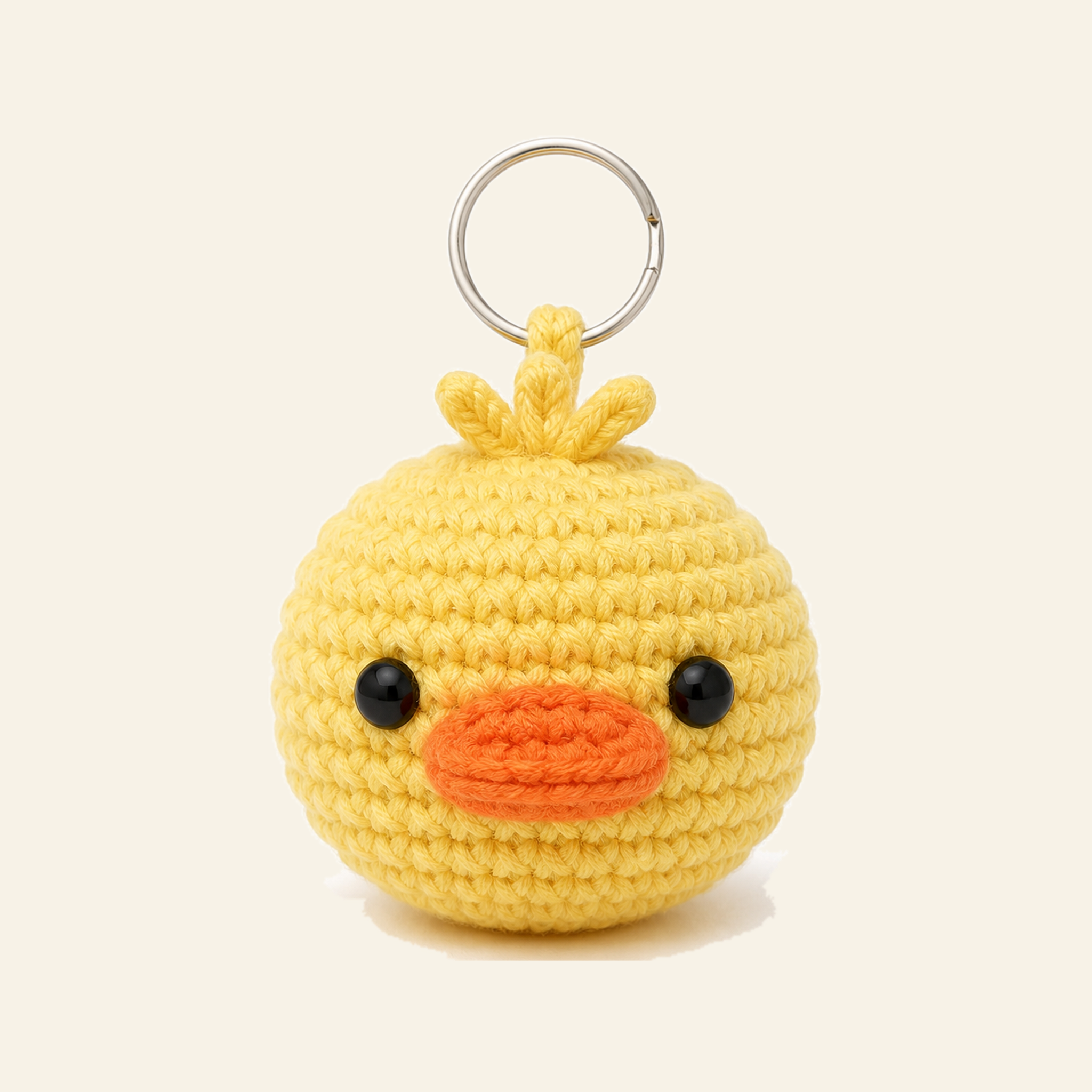 The finished crochet Duck bag charm on its own