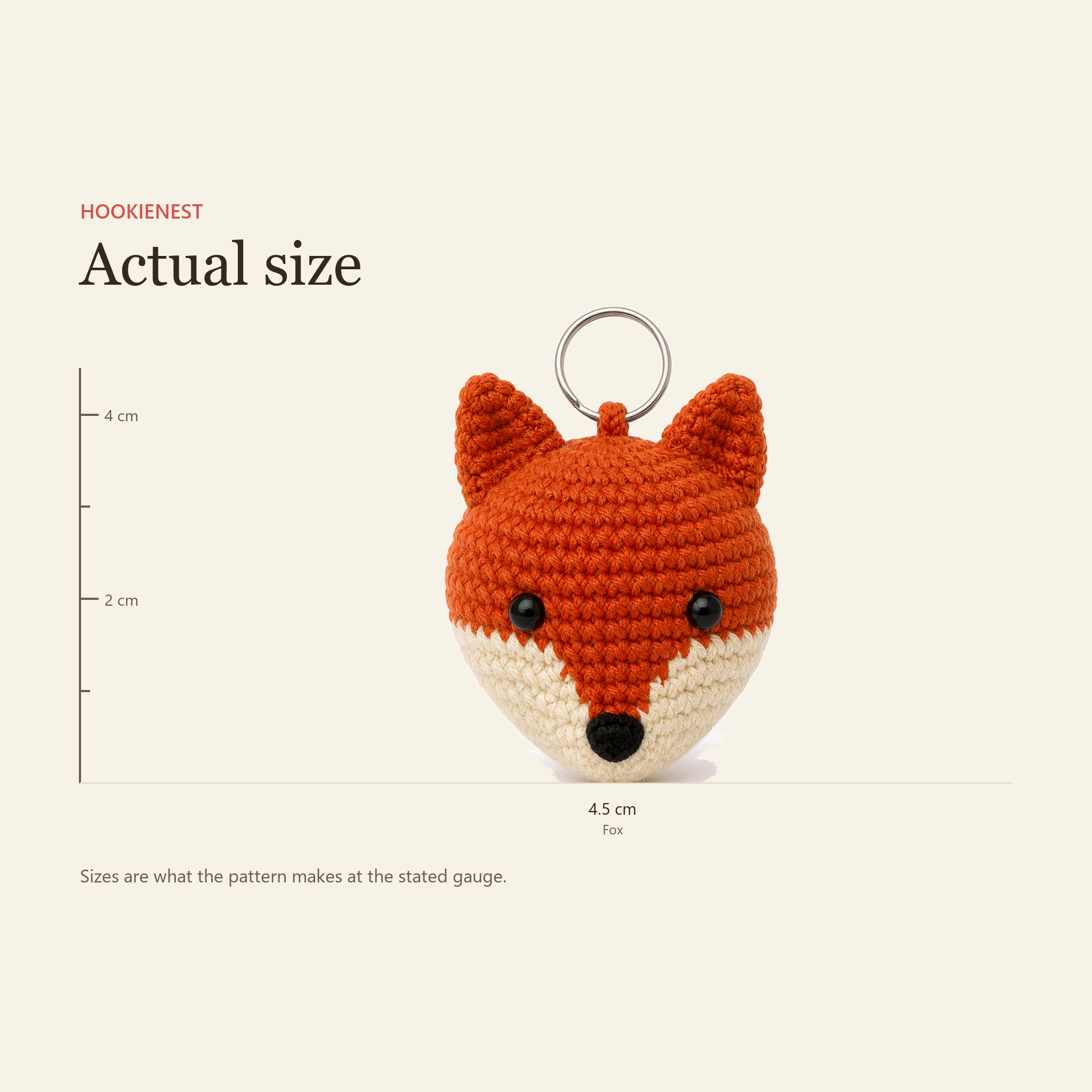 The Fox charm beside a centimetre ruler, finishing at 4.5 cm
