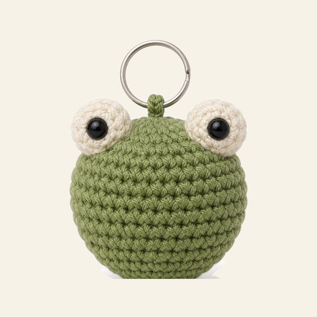 The finished crochet Frog bag charm on its own