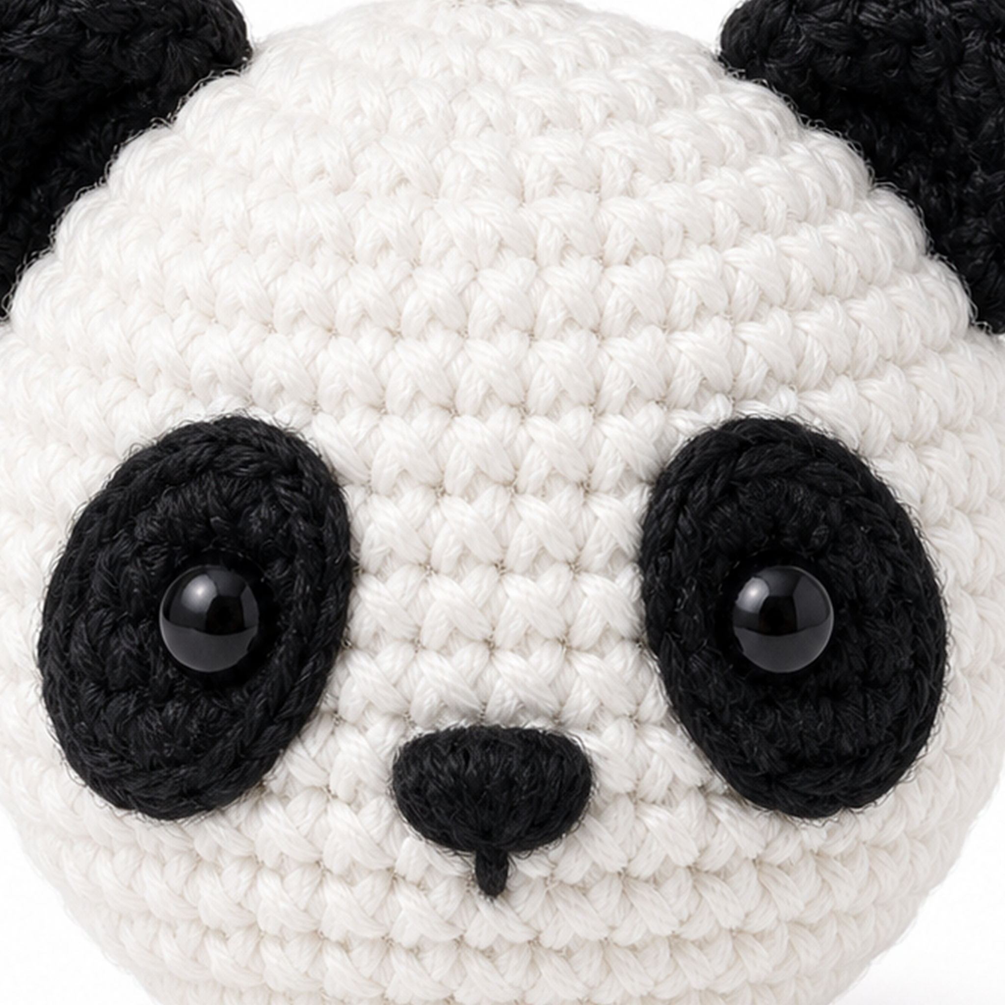 Close-up of the crochet stitches on the Panda charm