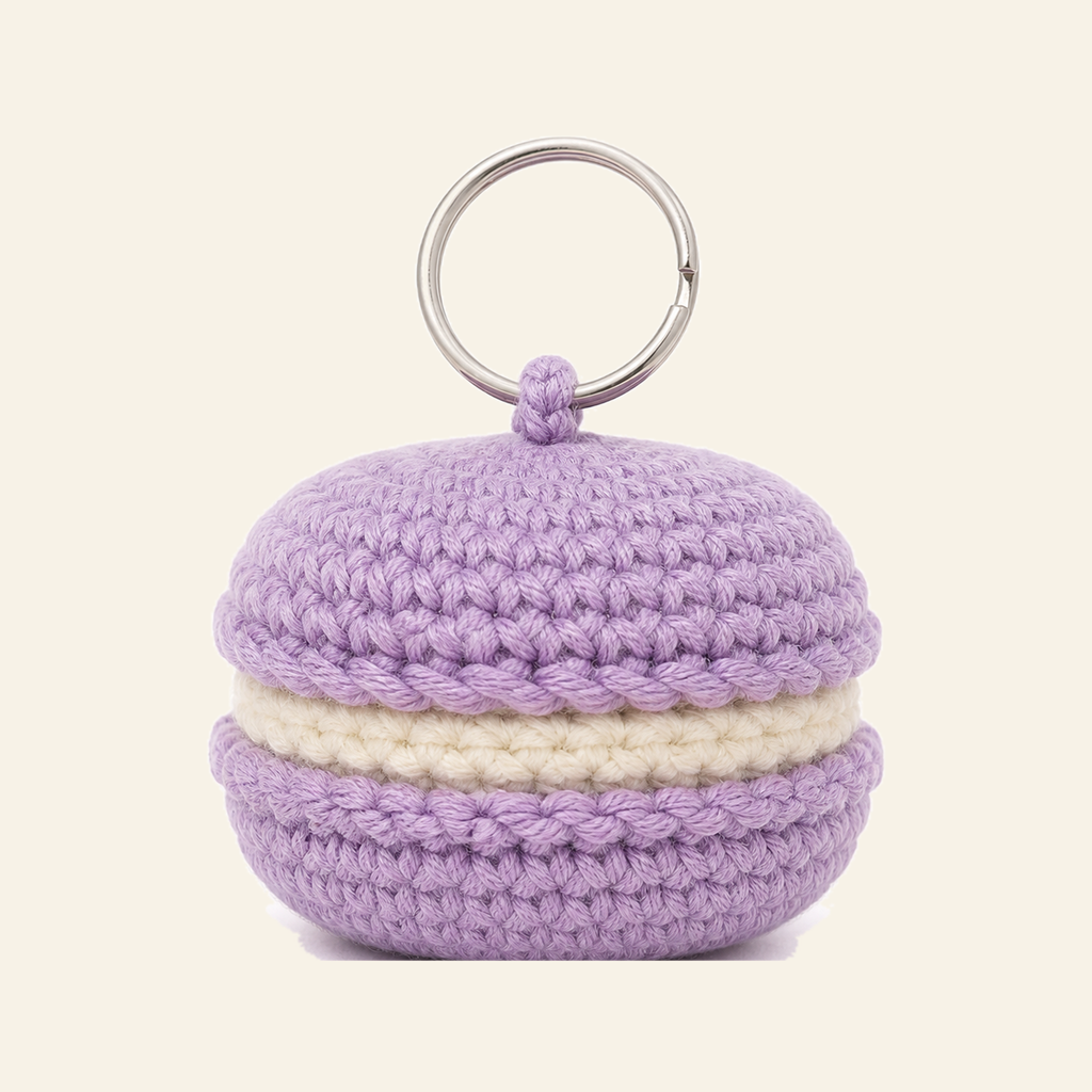 The finished crochet Macaron bag charm on its own