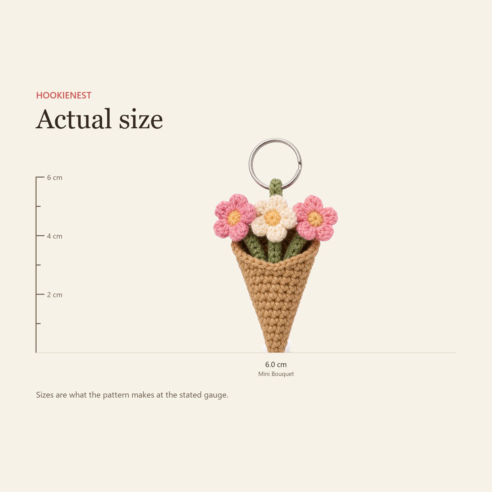 The Mini Bouquet keychain beside a centimetre ruler, finishing at 6.0 cm