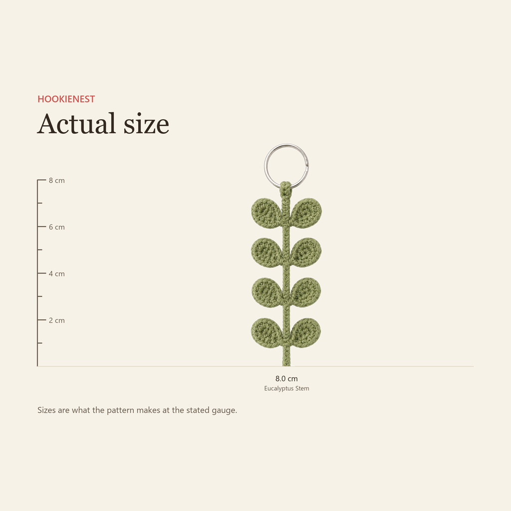 The Eucalyptus Stem keychain beside a centimetre ruler, finishing at 8.0 cm