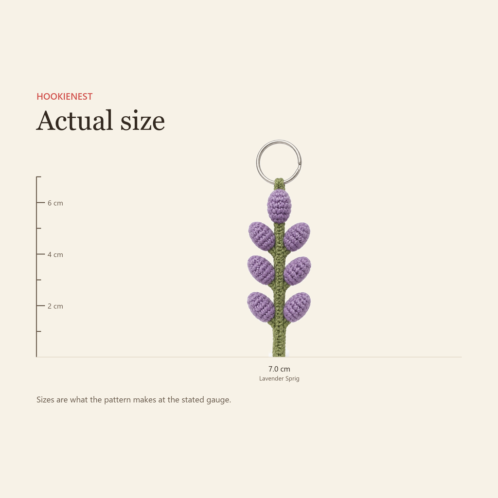 The Lavender Sprig keychain beside a centimetre ruler, finishing at 7.0 cm