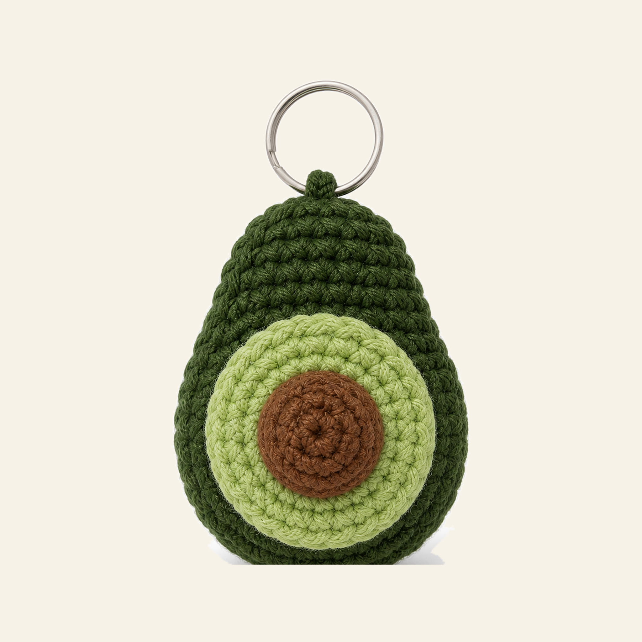The finished crochet Avocado bag charm on its own