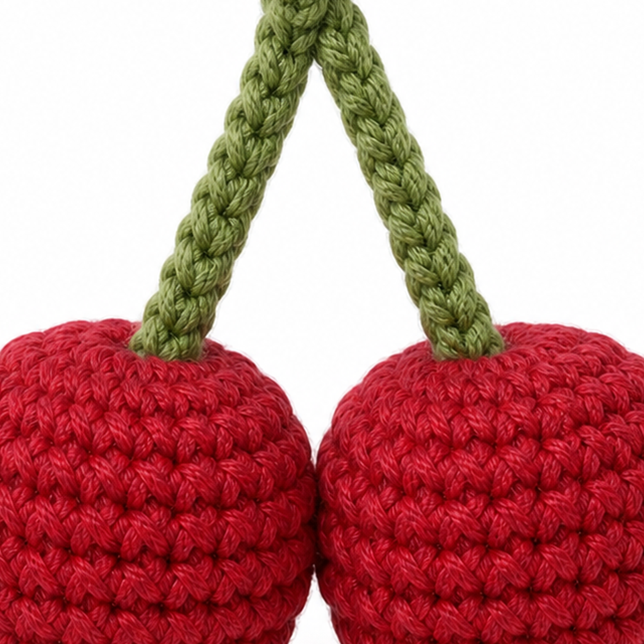 Close-up of the crochet stitches on the Cherry Pair charm