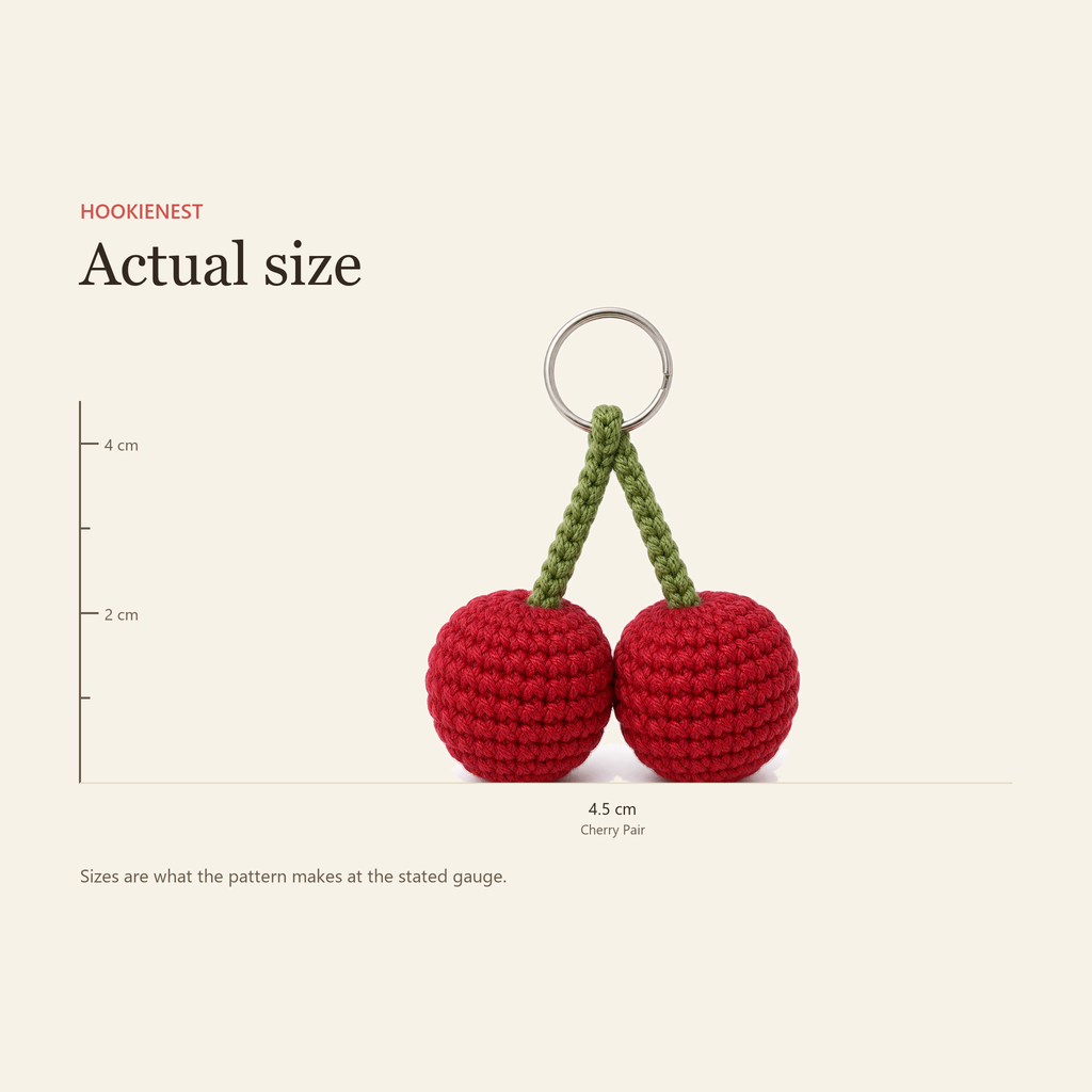 The Cherry Pair charm beside a centimetre ruler, finishing at 4.5 cm