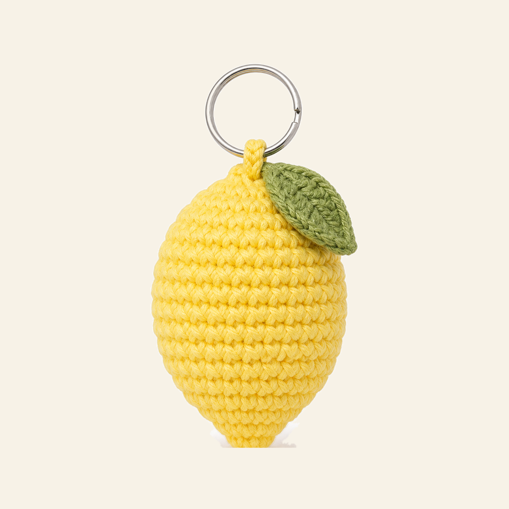 The finished crochet Lemon bag charm on its own
