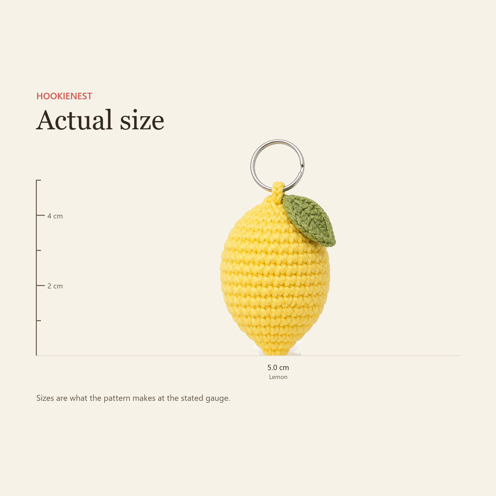 The Lemon charm beside a centimetre ruler, finishing at 5.0 cm