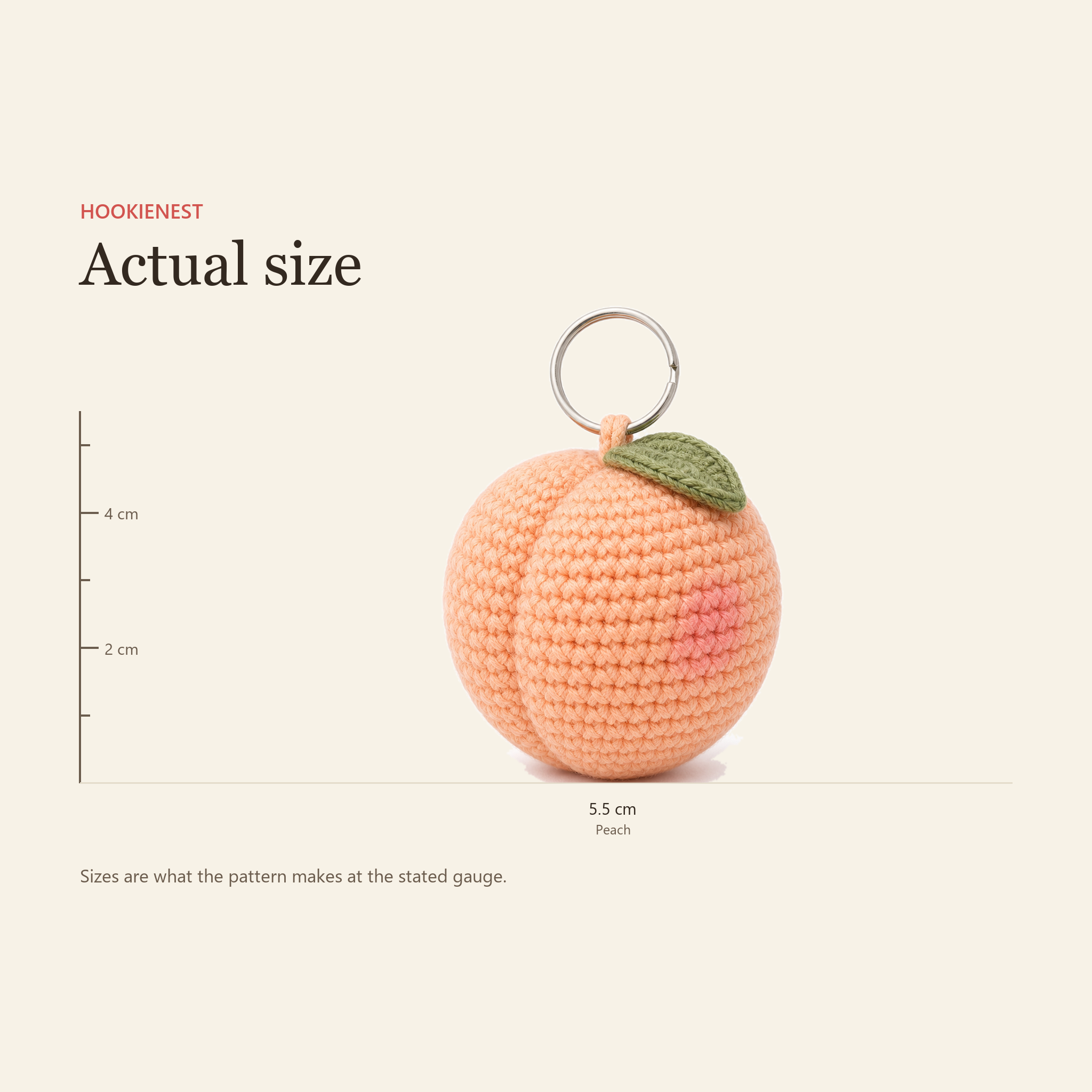 The Peach charm beside a centimetre ruler, finishing at 5.5 cm