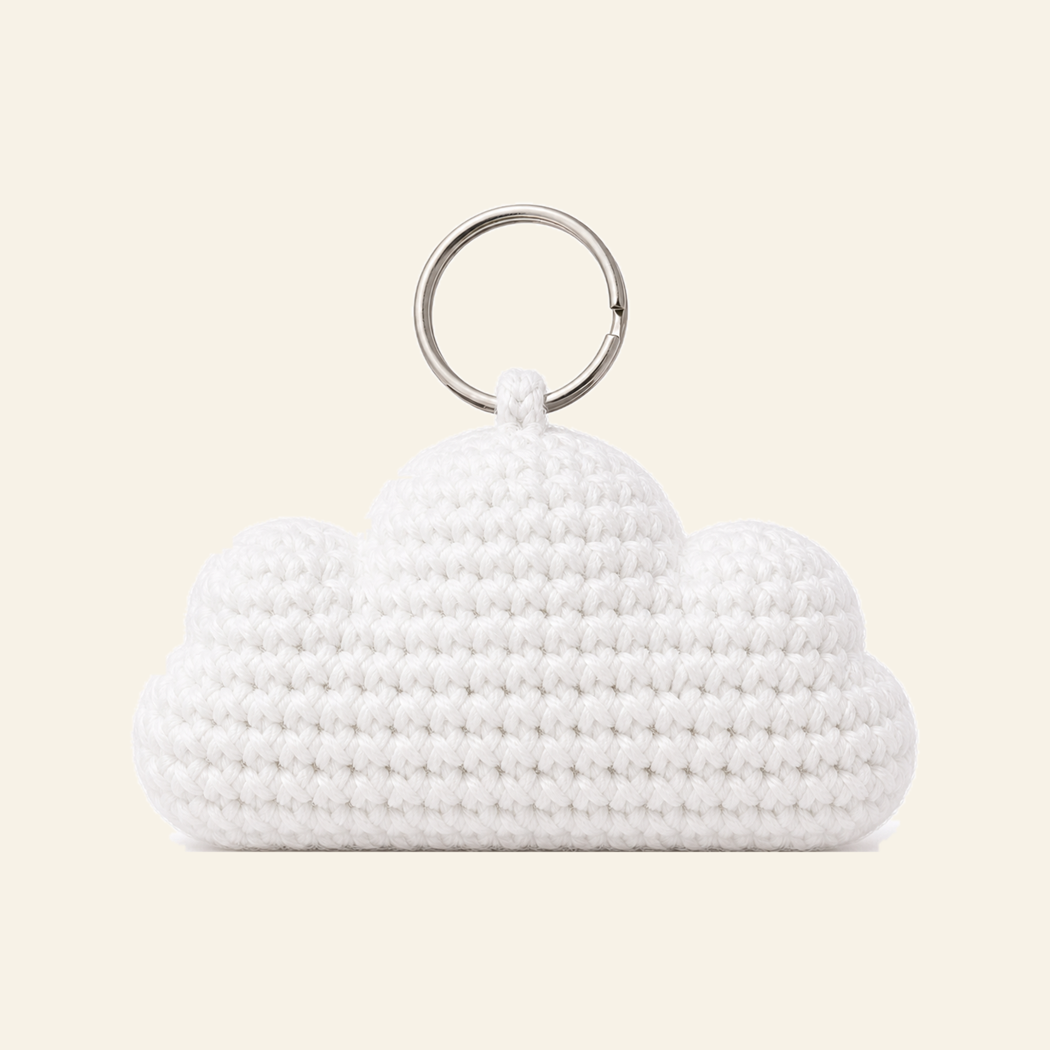 The finished crochet Cloud bag charm on its own