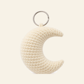 The finished crochet Crescent Moon bag charm on its own