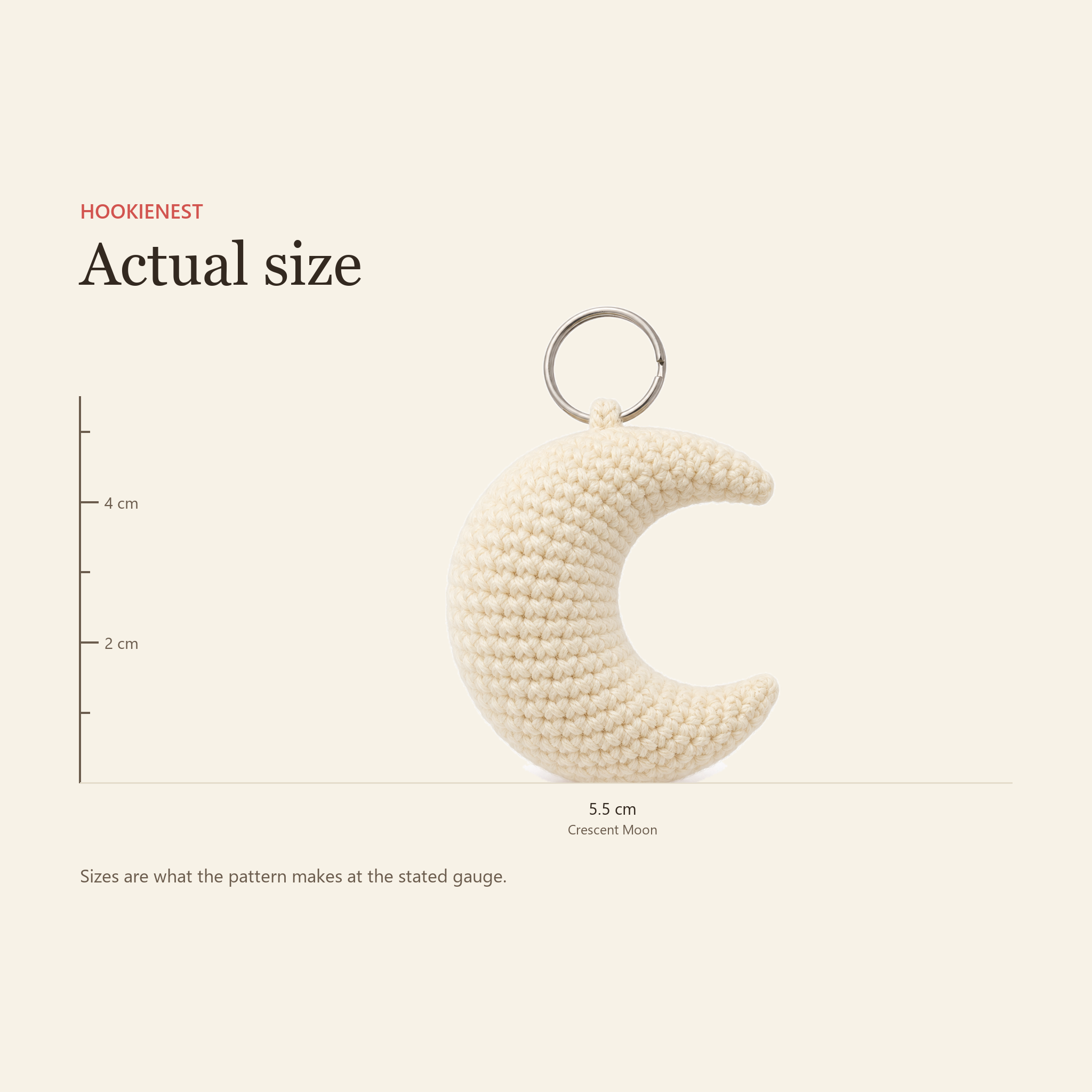 The Crescent Moon charm beside a centimetre ruler, finishing at 5.5 cm