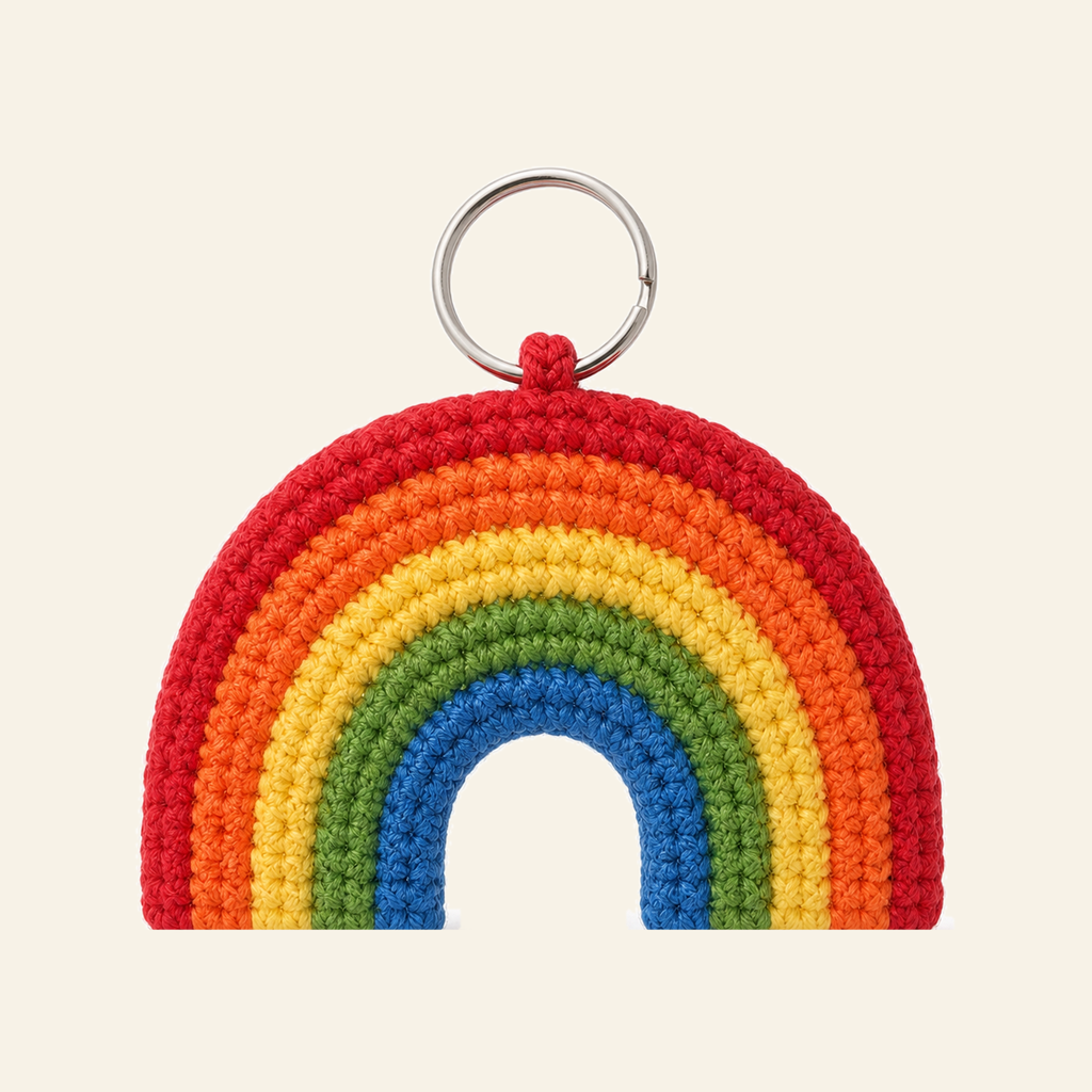 The finished crochet Rainbow bag charm on its own