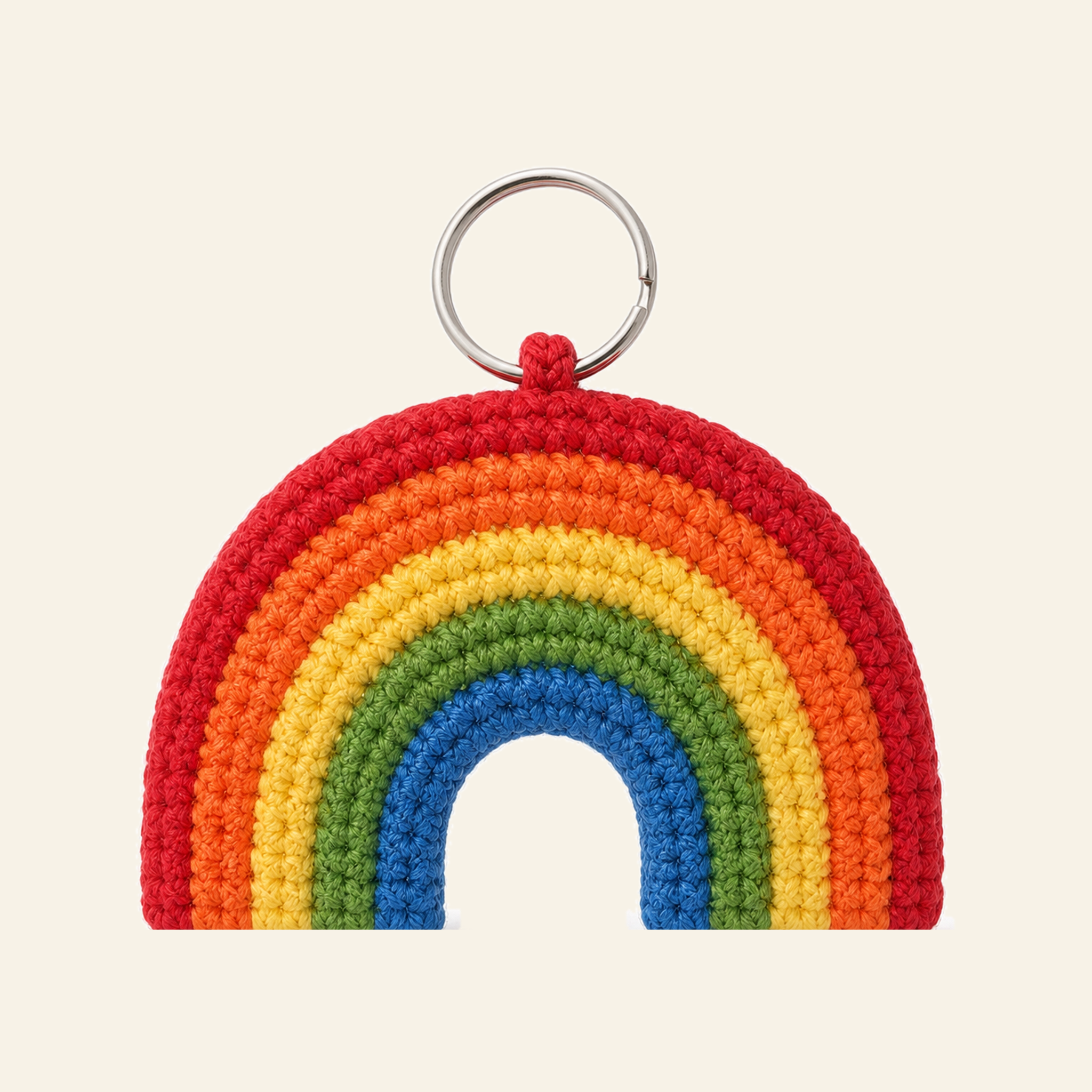 The finished crochet Rainbow bag charm on its own