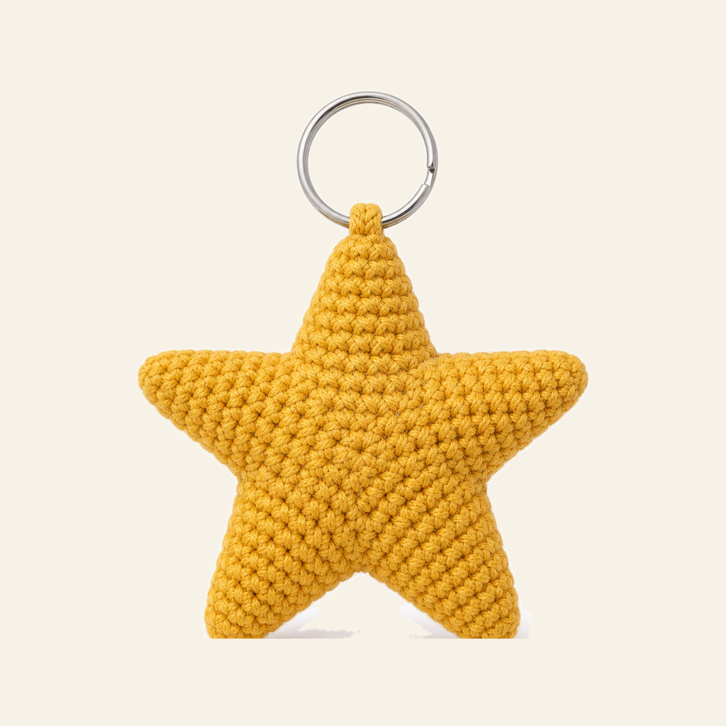 The finished crochet Star bag charm on its own