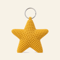 The finished crochet Star bag charm on its own