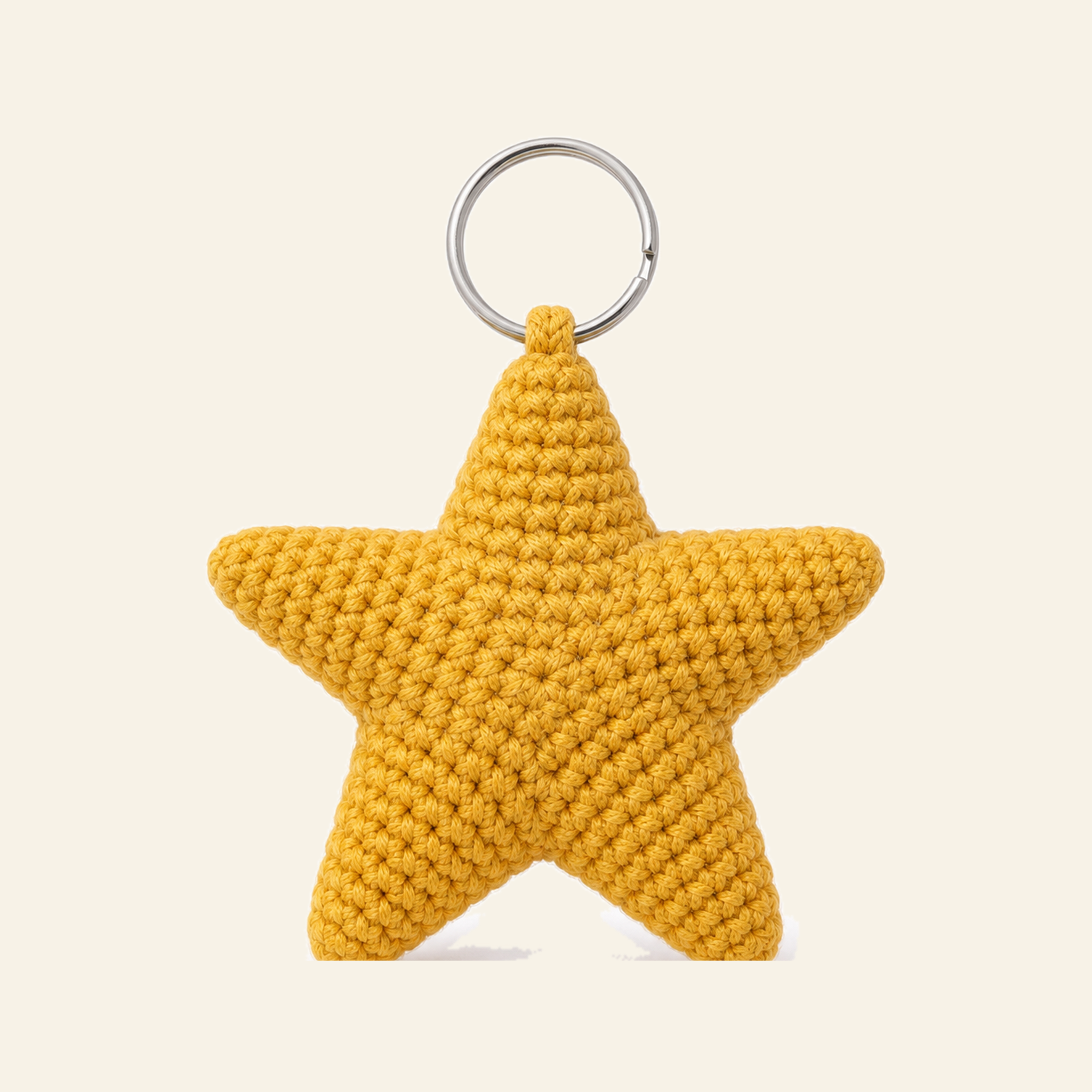 The finished crochet Star bag charm on its own