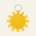 The finished crochet Sun bag charm on its own