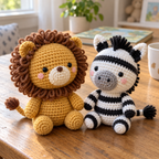 Close angled view of a crochet Lion loop mane and a Zebra striped cotton stitches on a wooden table.