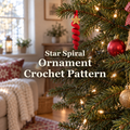 Red crochet spiral ornament with a gold crochet star hanging from a lit Christmas tree in a living room, with the title Star Spiral Ornament Crochet Pattern.