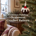 A dark-brown crochet Christmas pudding ornament with white icing, green holly leaves and red berries hangs from a Christmas tree branch beside a living-room window, with the product title across the centre.