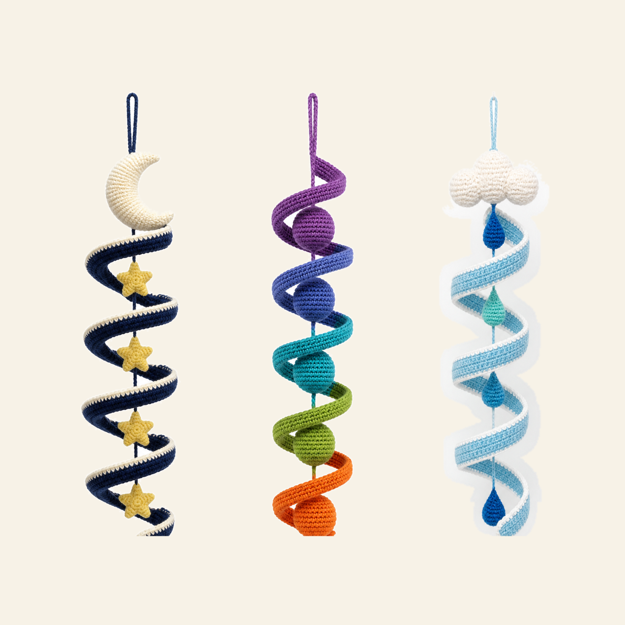 Three crochet wind spinners in a row - rainbow, rain cloud and night sky