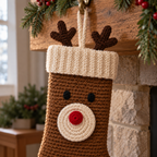A close view of the Reindeer crochet stocking showing its antlers, cream cuff, eyes and red nose.