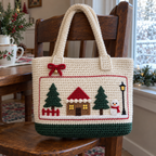 Cream crochet Cottage tote with green lower band hanging from a wooden chair beside a frosty window.