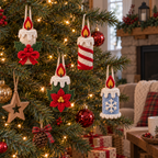 Holly Bow, Peppermint, Poinsettia and Snowflake crochet candle ornaments hanging on a Christmas tree.