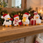 Stocking, Gentleman, Star and Gift crochet ducks displayed on a wooden mantel with Christmas greenery.