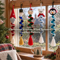 Five Christmas Friends crochet wind spinners hang from hooks across a wooden window, with a Christmas tree and a mug beside them.